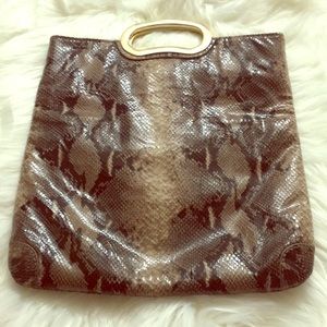 An authentic Gianni Bini snakeskin purse